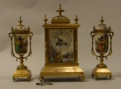 A late 19th Century French lacquered brass cased clock garniture the eight day movement by Japy