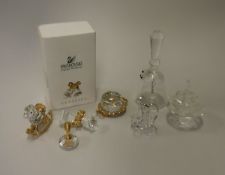 A collection of four Swarovski Crystal Memories Classics comprising rocking horse, atomiser,