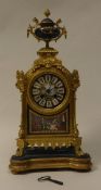 A 19th Century gilt brass cased mantel clock the eight day movement by Japy Freres of Paris the