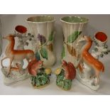 A collection of Staffordshire pottery to include a pair of stag spill vases,