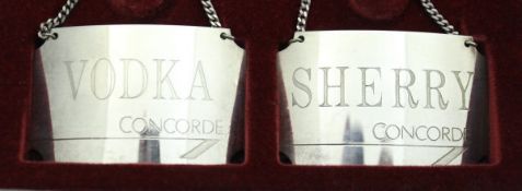 A pair of late 20th Century silver Concorde spirit labels, one inscribed "Vodka",