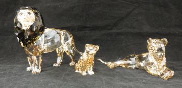 A Swarovski Crystal Society model coloured crystal lion with lioness and cub (boxed)