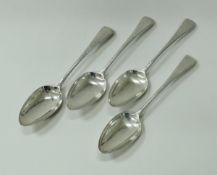 A set of four George III silver feather edged table spoons (by Richard Crossley and George Smith IV,