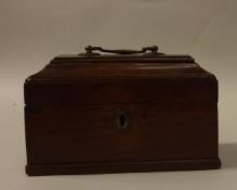 A late 18th Century Dutch mahogany tobacco box of tea caddy form with brass swan neck handle,