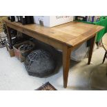 A 19th Century French cherry wood farmhouse kitchen table the plank top with cleated ends over an