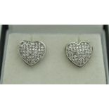 A pair of 9ct gold pave set diamond heart shaped ear studs