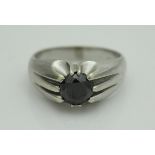 A 9 carat white gold black diamond solitaire ring, the stone approx 1.