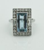 An 18 carat white gold aquamarine and diamond ring in the Art Deco manner,