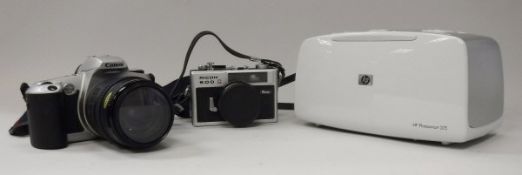 A Canon EOS 500 camera,