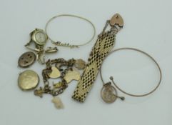 A collection of gold jewellery to include a 9 carat gold charm bracelet with various 9 carat gold