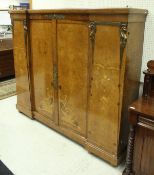 A French thuya wood and marquetry inlaid breakfront side cabinet with bronze mounts in the Empire