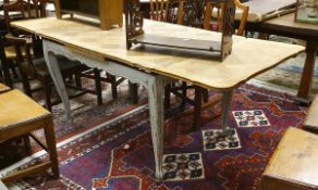 An early 20th Century oak parquetry work extending dining table on painted base
