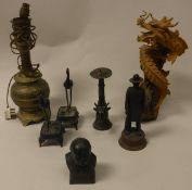 A Victorian embossed brass oil lamp base, an Oriental dragon figure, a spelter figure of a huntsman,