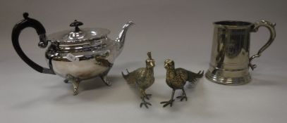 A box containing assorted plated wares, to include a teapot, tankards, model pheasants,