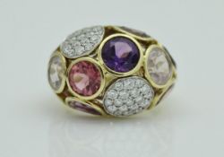 An 18 carat gold diamond and purple and pink hued gem set ring, stamped 'FABERGE' and No'd.