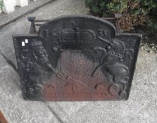 A cast iron fire back inscribed "1635",