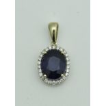 A 14 carat gold mounted sapphire and diamond pendant,