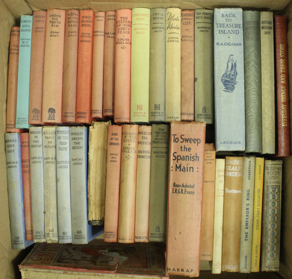 A box of books to include CAPTAIN W.E.
