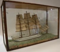 A nautical diorama of a three masted vessel in full sail "Bettie" in four signed glazed display