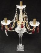 A cut glass and ruby glass four branch épergne