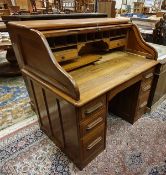 An early 20th Century tambour-top double-pedestal desk