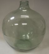 A pale green glass carboy