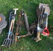 A collection of garden tools to include spades, forks, etc,