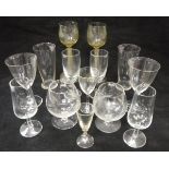 A set of four Dutch green/yellow glass roemers with grape and vine engraved decoration on a fine