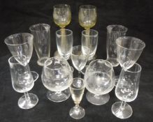 A set of four Dutch green/yellow glass roemers with grape and vine engraved decoration on a fine