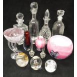 A collection of various glassware to include four decanters, Caithness paperweight and two others,
