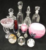 A collection of various glassware to include four decanters, Caithness paperweight and two others,