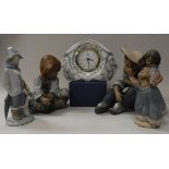 A collection of Lladro figures to include child in scarf with dog at fee (D28F),