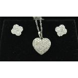 A diamond studded 9 carat white gold heart shaped pendant on chain,