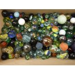 A modern box containing a large quantity of various marbles and a deed box containing various