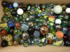 A modern box containing a large quantity of various marbles and a deed box containing various