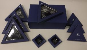 A collection of Swarovski christmas ornaments comprising 2004, 2005,