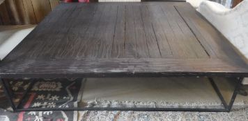 A modern metal-framed plank top coffee table of large proportions