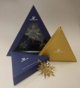 A collection of Swarovski christmas ornaments comprising 2009,