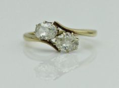 An 18 carat gold two stone diamond ring, approx 0.9 carat total, approx 2.