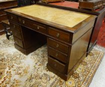 A mahogany double-pedestal desk in the 19th Century style