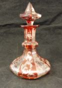 A 19th Century bohemian ruby overlaid and cut glass dressing table scent bottle of faceted baluster