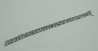 A 9 carat white gold and diamond bracelet, approx 29 cm long, approx 16.