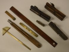 A box of various wood-working tools to include moulding planes, other planes, two small squares,