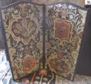 A pair of 20th Century upholstered two fold screens in the Continental taste decorated with