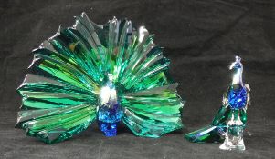 A Swarovski Crystal Society coloured crystal peacock arya in display pose together with a further