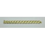 An 18 carat gold and diamond set bracelet of repeating design,