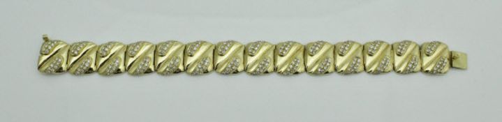 An 18 carat gold and diamond set bracelet of repeating design,