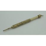 A yellow metal propelling pencil by WS Hicks of New York,