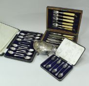 A cased set of twelve George V silver teaspoons with matching sugar tongs (by Duncan & Scobbie,