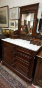 A circa 1900 French mahogany dressing chest with mirrored superstructure over a marble top and four